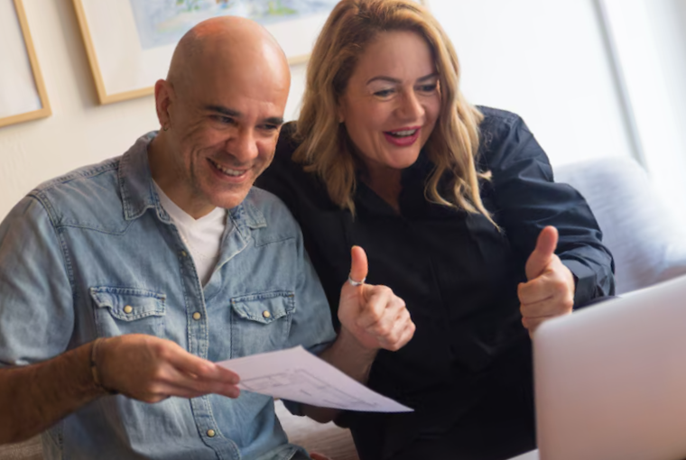 Middle aged couple showing thumb up
